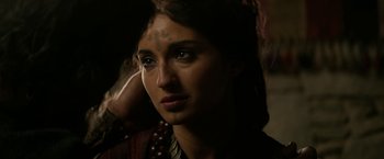 Movie still from “Exodus: Gods and Kings” (2014), directed by Ridley Scott – A person with a tattoo on their face; Close Up shot, Over the shoulder angle