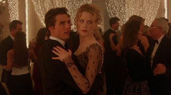 Movie still from “Eyes Wide Shut” (1999), directed by Stanley Kubrick – A man and a woman are dancing in a ballroom; Medium shot, Low angle