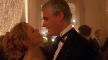 Movie still from “Eyes Wide Shut” (1999), directed by Stanley Kubrick – A man and a woman in formal wear looking at one another; Close Up shot, Low angle