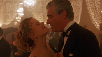 Movie still from “Eyes Wide Shut” (1999), directed by Stanley Kubrick – A man and a woman in formal wear kissing; Close Up shot, Low angle