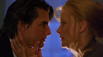 Movie still from “Eyes Wide Shut” (1999), directed by Stanley Kubrick – A man and a woman face to face in front of a window; Close Up shot, Low angle