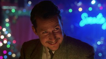 Movie still from “Eyes Wide Shut” (1999), directed by Stanley Kubrick – A person wearing a suit and tie; Close Up shot, Low angle