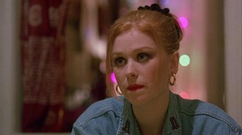 Movie still from “Eyes Wide Shut” (1999), directed by Stanley Kubrick – A person wearing a jean jacket; Close Up shot, Over the shoulder angle