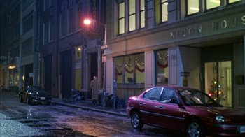 Movie still from “Eyes Wide Shut” (1999), directed by Stanley Kubrick – A car parked on the side of the street at night; Extreme Wide shot, Low angle