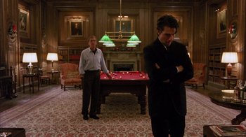 Movie still from “Eyes Wide Shut” (1999), directed by Stanley Kubrick – Two men standing in front of a billiards table; Wide shot, Over the shoulder angle
