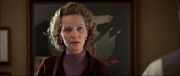 Movie still from “Face/Off” (1997), directed by John Woo – A person wearing a purple shirt; Close Up shot, Low angle