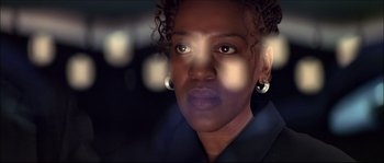 Movie still from “Face/Off” (1997), directed by John Woo – A woman's face in the dark; Close Up shot, Low angle