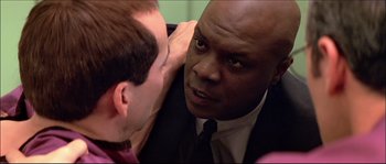 Movie still from “Face/Off” (1997), directed by John Woo – A person talking to another person; Close Up shot, Over the shoulder angle