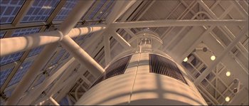 Movie still from “Face/Off” (1997), directed by John Woo – Looking up at the ceiling of an industrial building; Extreme Wide shot, Low angle