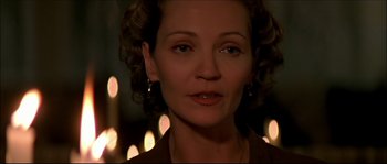 Movie still from “Face/Off” (1997), directed by John Woo – A person wearing a necklace; Close Up shot, Over the shoulder angle