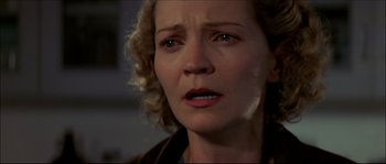 Movie still from “Face/Off” (1997), directed by John Woo – A person with her eyes wide open; Close Up shot, Low angle