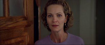 Movie still from “Face/Off” (1997), directed by John Woo – A person wearing a purple shirt; Close Up shot, Low angle