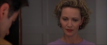 Movie still from “Face/Off” (1997), directed by John Woo – A person wearing a purple shirt; Close Up shot, Low angle