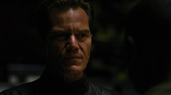 Movie still from “Fahrenheit 451” (2018), directed by Ramin Bahrani – A person wearing a leather jacket; Close Up shot, Over the shoulder angle