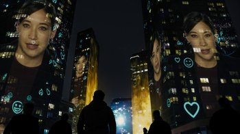 Movie still from “Fahrenheit 451” (2018), directed by Ramin Bahrani – A group of people standing in front of tall buildings; Extreme Wide shot, Low angle