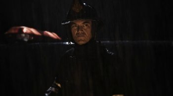 Movie still from “Fahrenheit 451” (2018), directed by Ramin Bahrani – A man wearing a black uniform and a black helmet; Close Up shot, Low angle