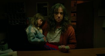 Movie still from “Fast Color” (2018), directed by Julia Hart – A woman and a child sitting at a table; Medium shot, Low angle