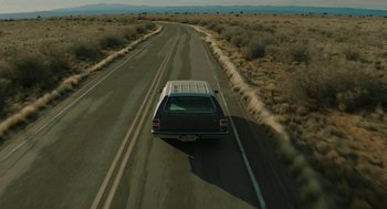 Movie still from “Fast Color” (2018), directed by Julia Hart – A car driving down the middle of the road; Extreme Wide shot, High angle