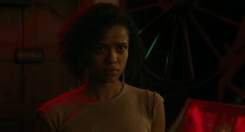 Movie still from “Fast Color” (2018), directed by Julia Hart – A woman with curly black hair standing in a dark room; Close Up shot, Low angle