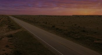 Movie still from “Fast Color” (2018), directed by Julia Hart – An image of an empty road at dusk or dawn; Extreme Wide shot, High angle