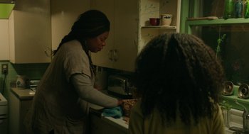 Movie still from “Fast Color” (2018), directed by Julia Hart – Two women in a kitchen preparing a meal together; Medium shot, Over the shoulder angle