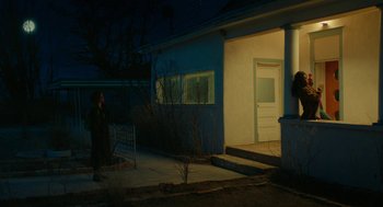 Movie still from “Fast Color” (2018), directed by Julia Hart – A person standing outside of a house at night; Extreme Wide shot, Low angle
