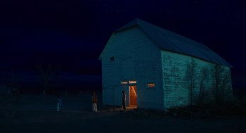 Movie still from “Fast Color” (2018), directed by Julia Hart – A couple of people standing in front of an old barn; Extreme Wide shot, Low angle