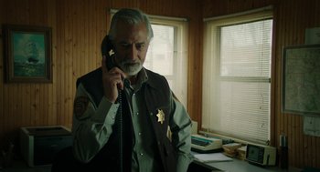 Movie still from “Fast Color” (2018), directed by Julia Hart – An older man talking on a phone in a room; Close Up shot, Low angle