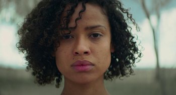 Movie still from “Fast Color” (2018), directed by Julia Hart – A person with curly hair; Close Up shot, Low angle