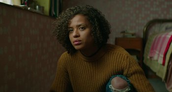 Movie still from “Fast Color” (2018), directed by Julia Hart – A young woman holding a baby in her arms; Medium shot, Low angle