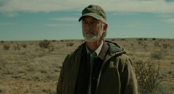 Movie still from “Fast Color” (2018), directed by Julia Hart – An older man with a beard wearing a hat and a jacket; Close Up shot, Over the shoulder angle