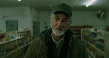 Movie still from “Fast Color” (2018), directed by Julia Hart – An older man wearing a green hat and a jacket; Close Up shot, Low angle