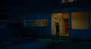 Movie still from “Fast Color” (2018), directed by Julia Hart – A person standing in front of a door at night; Extreme Wide shot, Low angle