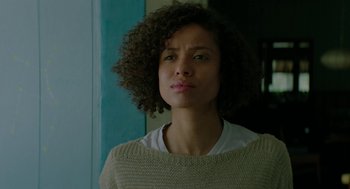 Movie still from “Fast Color” (2018), directed by Julia Hart – A person with curly hair wearing a sweater; Close Up shot, Low angle