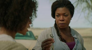 Movie still from “Fast Color” (2018), directed by Julia Hart – A woman holding a pair of scissors talking to another woman; Close Up shot, Over the shoulder angle