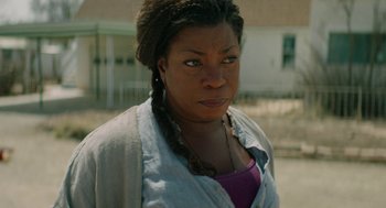 Movie still from “Fast Color” (2018), directed by Julia Hart – A person wearing a purple shirt; Close Up shot, Over the shoulder angle