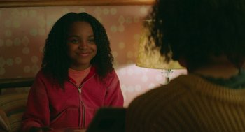 Movie still from “Fast Color” (2018), directed by Julia Hart – A young girl is looking at her reflection in a mirror; Close Up shot, Over the shoulder angle