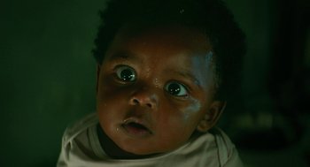 Movie still from “Fast Color” (2018), directed by Julia Hart – A baby's face with water on it's eyes; Close Up shot, Low angle
