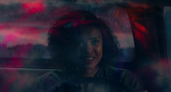Movie still from “Fast Color” (2018), directed by Julia Hart – A woman sitting in the back seat of a car; Close Up shot, Over the shoulder angle