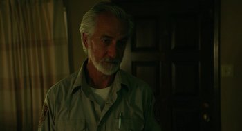 Movie still from “Fast Color” (2018), directed by Julia Hart – An older man with a gray beard is standing in a room; Close Up shot, Low angle