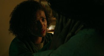 Movie still from “Fast Color” (2018), directed by Julia Hart – A woman looking at another woman in a dark room; Close Up shot, Over the shoulder angle