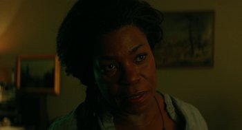 Movie still from “Fast Color” (2018), directed by Julia Hart – A woman's face in a dark room; Close Up shot, Over the shoulder angle