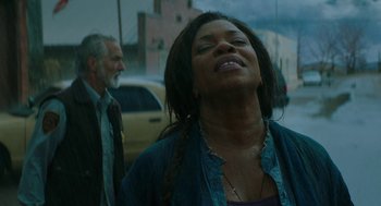Movie still from “Fast Color” (2018), directed by Julia Hart – A woman standing next to a man on the street; Close Up shot, Low angle