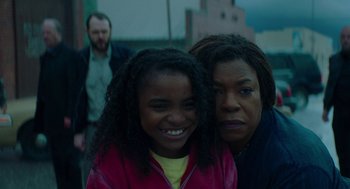Movie still from “Fast Color” (2018), directed by Julia Hart – A woman and a girl smiling for the camera; Close Up shot, High angle