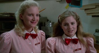 Movie still from “Fast Times at Ridgemont High” (1982), directed by Amy Heckerling – Two young girls wearing red and white striped shirts and bow ties; Close Up shot, Low angle