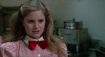 Movie still from “Fast Times at Ridgemont High” (1982), directed by Amy Heckerling – A young girl with a red bow tie in a kitchen; Close Up shot, Over the shoulder angle