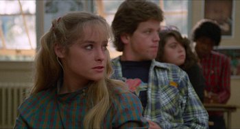 Movie still from “Fast Times at Ridgemont High” (1982), directed by Amy Heckerling – A group of young people sitting in a room; Close Up shot, Over the shoulder angle