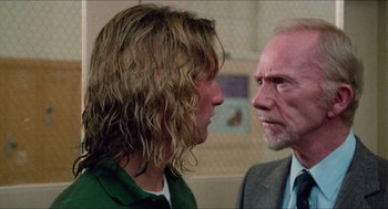 Movie still from “Fast Times at Ridgemont High” (1982), directed by Amy Heckerling – A man and a woman face each other in a room; Close Up shot, Over the shoulder angle