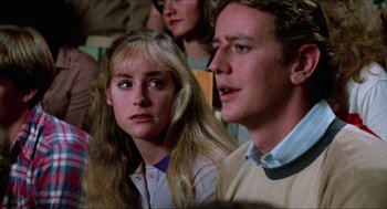 Movie still from “Fast Times at Ridgemont High” (1982), directed by Amy Heckerling – A man and a woman sitting next to each other; Close Up shot, Over the shoulder angle