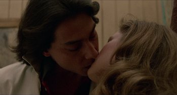 Movie still from “Fast Times at Ridgemont High” (1982), directed by Amy Heckerling – A man and a woman kissing each other; Close Up shot, Low angle